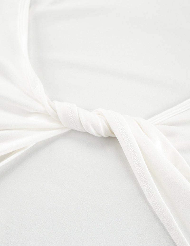 White knotted camisole top with gathered fabric at the front center