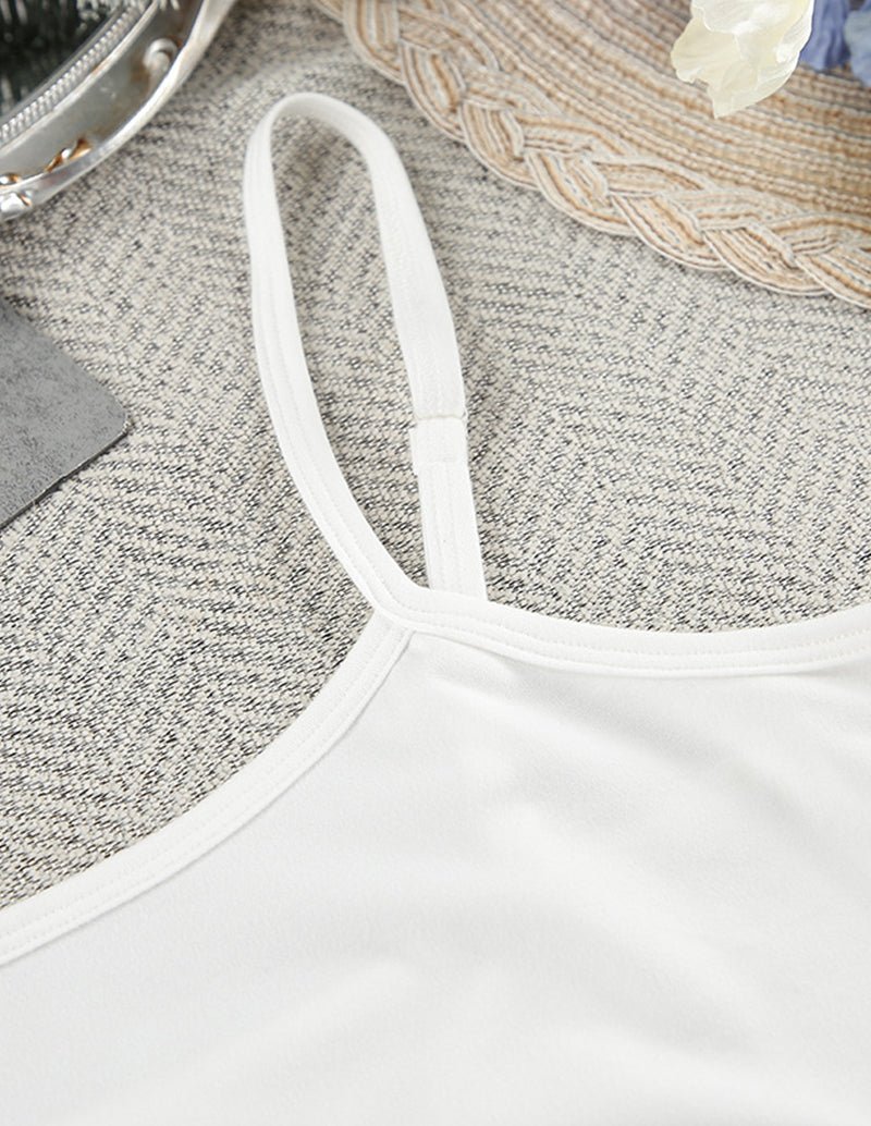 White camisole top with thin spaghetti straps and soft jersey fabric