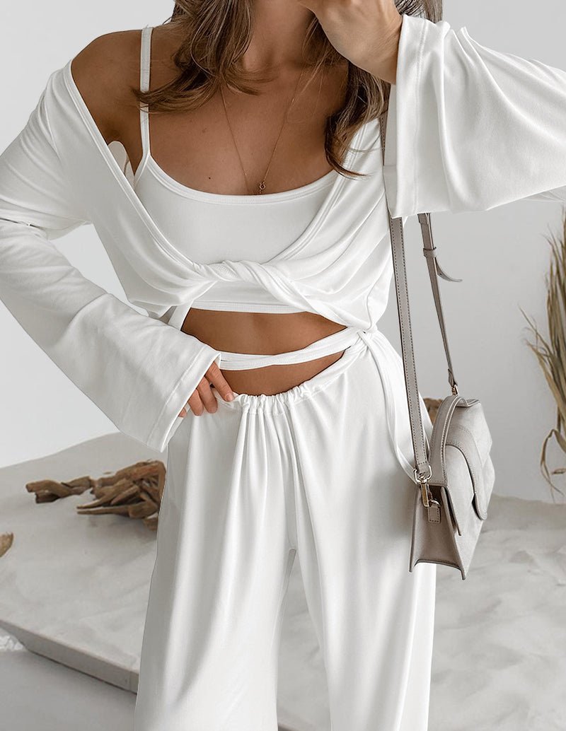 White lounge set with spaghetti-strap camisole under knotted wrap crop top