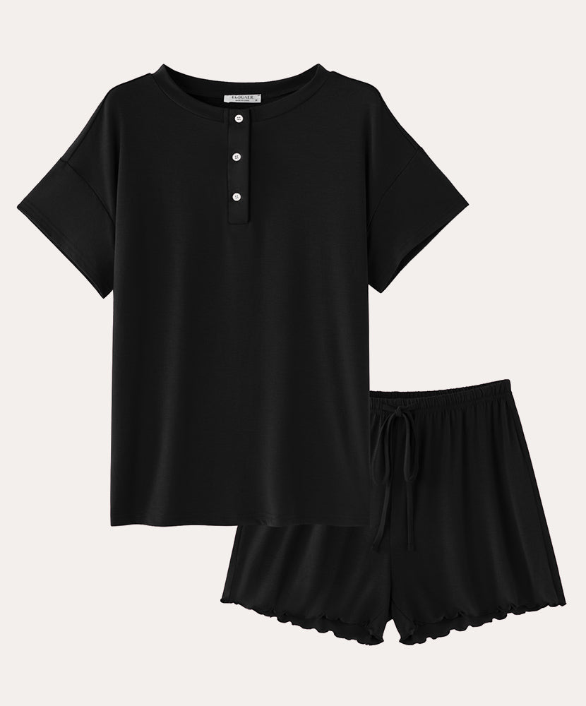 Cotton pajama set in black: short-sleeve henley top and drawstring sleep shorts.