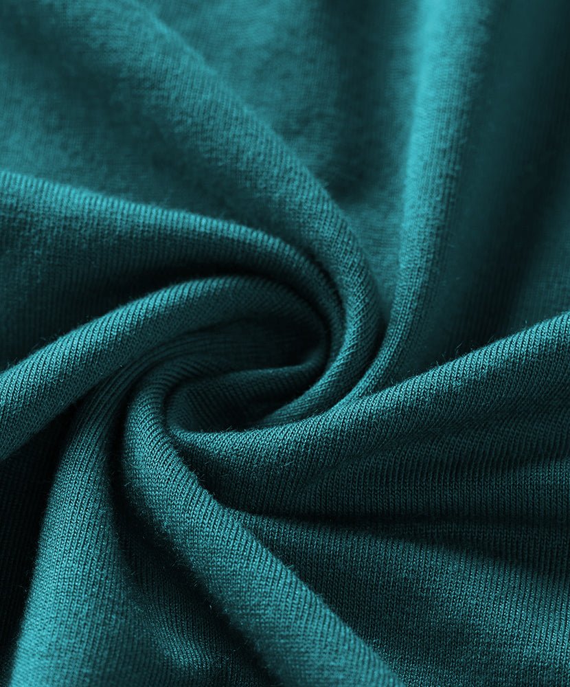 Teal cotton pajama fabric close-up with soft knit texture