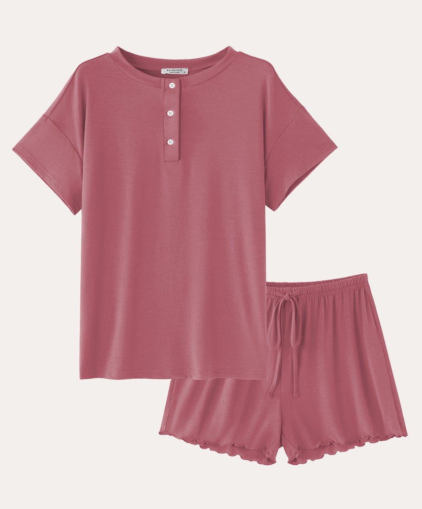 Cotton pajama set in rose: short-sleeve henley top and drawstring sleep shorts.