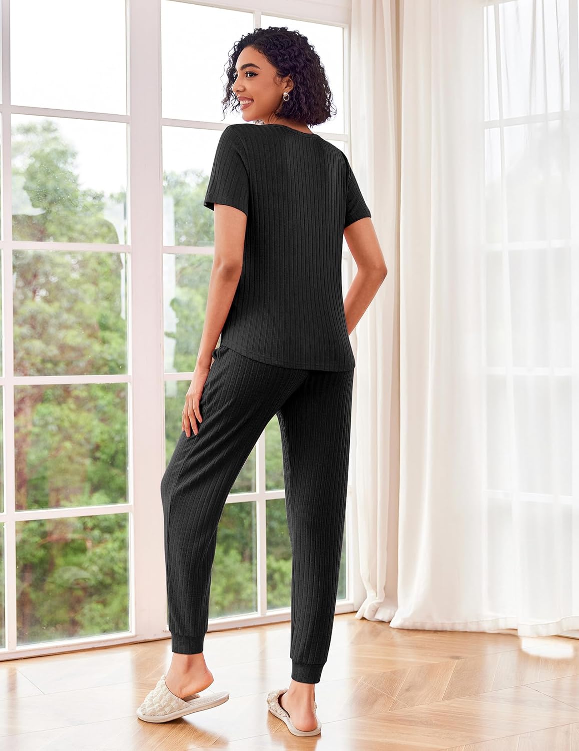 Rib knit lounge set in black: back view of short-sleeve top with jogger pants