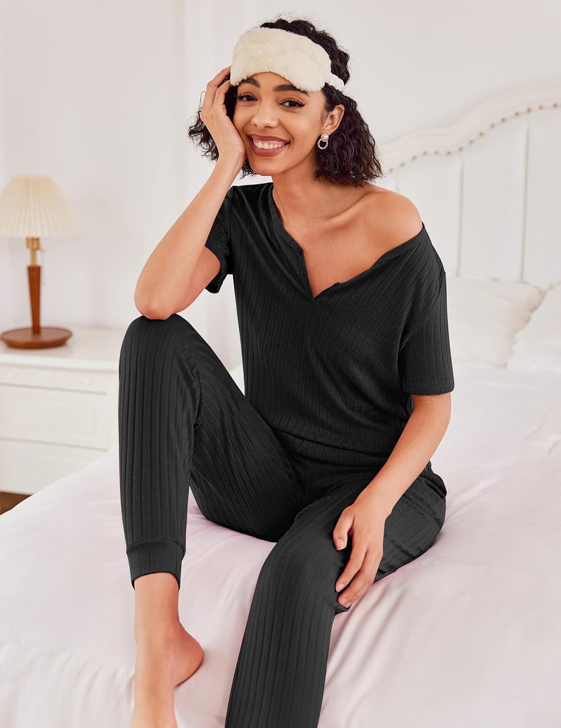 Rib knit lounge set in black: asymmetric one-shoulder top with matching jogger pants