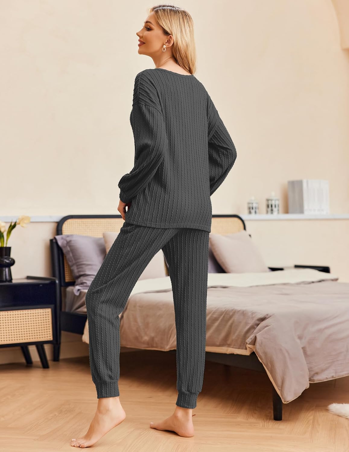 Ribbed knit long-sleeve pullover with matching dark gray jogger pants, side view