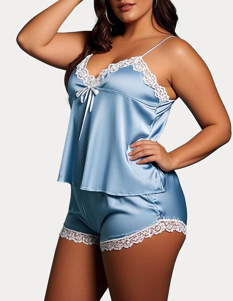 Blue satin camisole and shorts pajama set with white lace trim and tie straps.