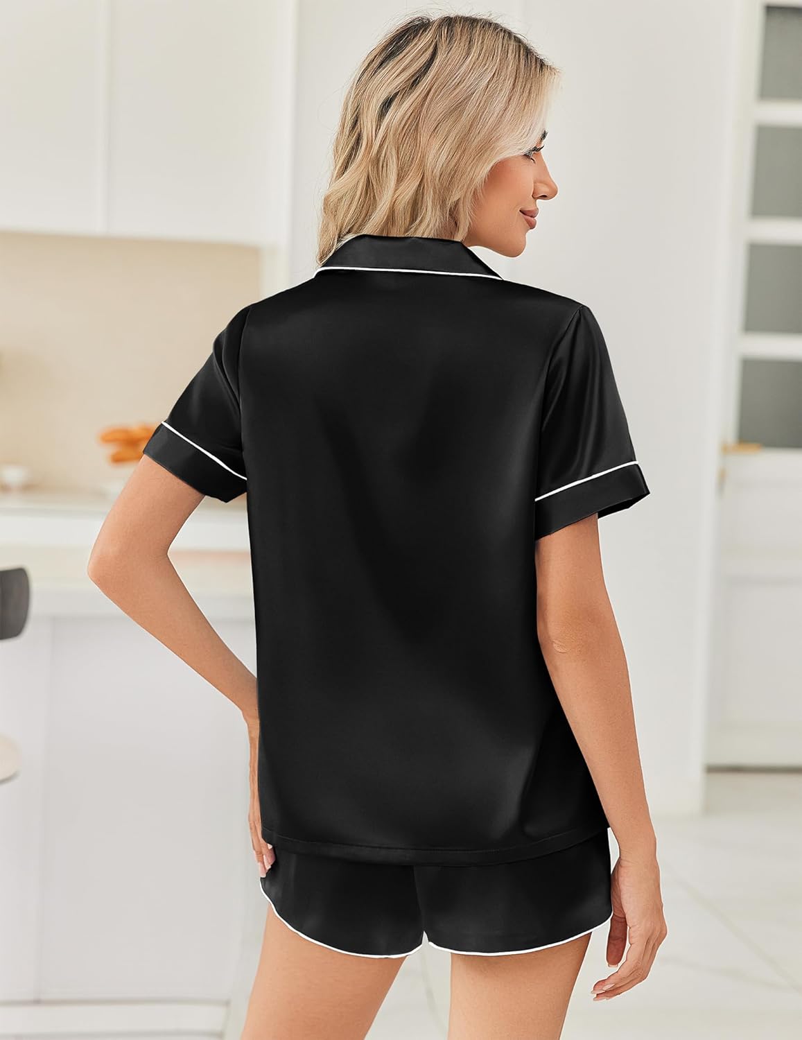 Black satin pajama set, short-sleeve button-up shirt and matching shorts, back view