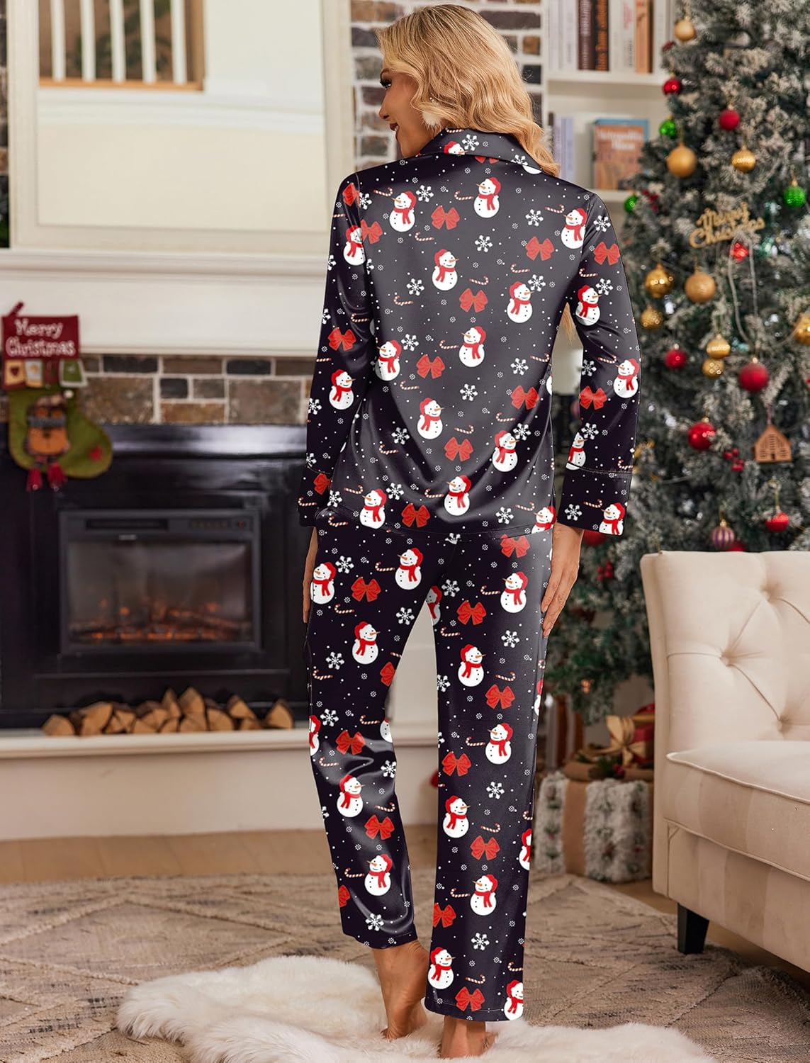 Back view: satin button-down lounge set with long pants, dark base and snowman print