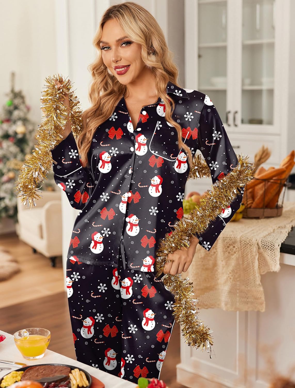 Satin button-down lounge set with long sleeves and pants, dark base with festive snowman pattern