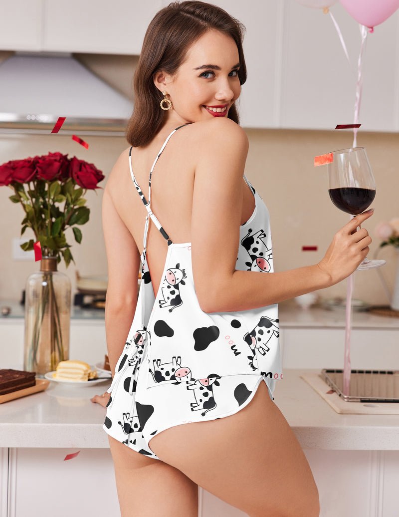 Black-and-white cow print satin pajama set with backless camisole and matching shorts