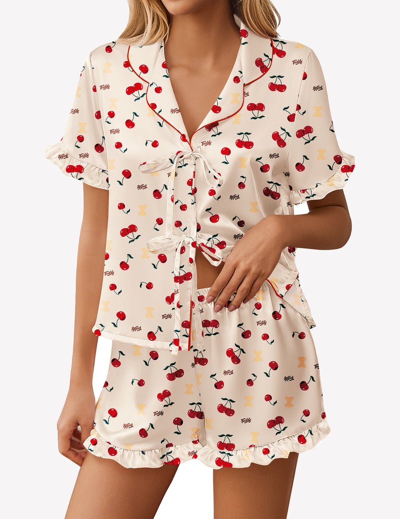 Cream satin pajama short set with red cherry print and bow tie front