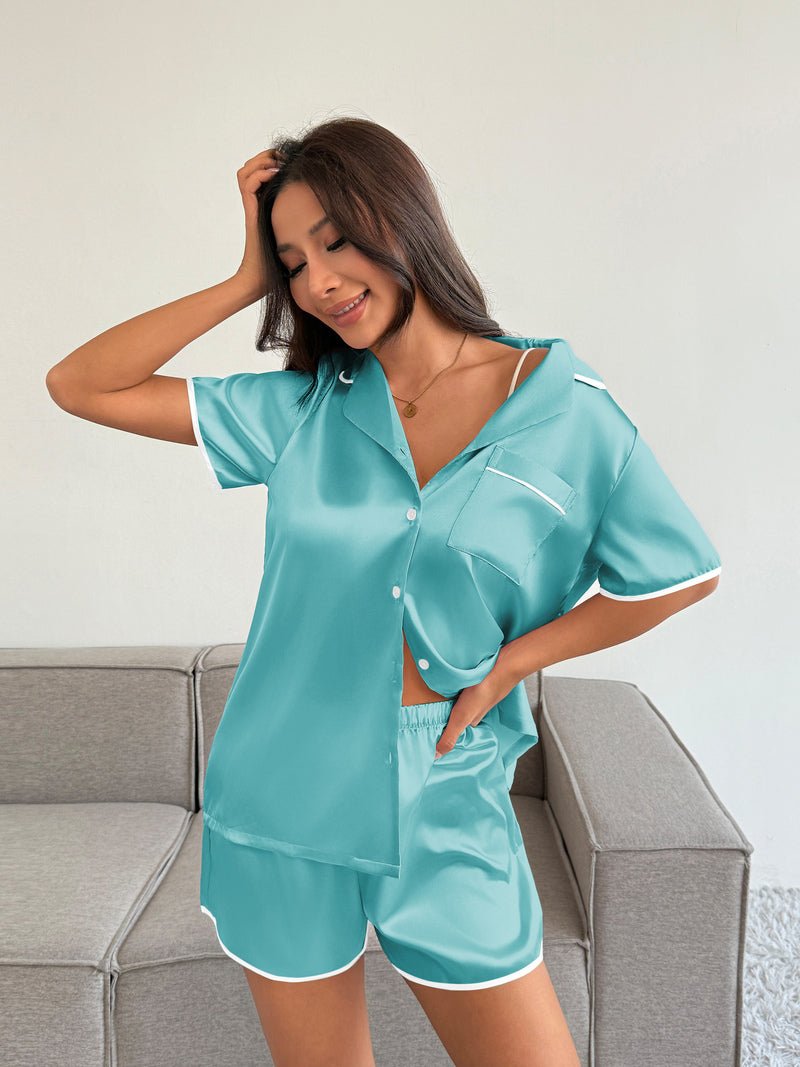 Satin pajama set in light blue: button-front short-sleeve top and matching shorts