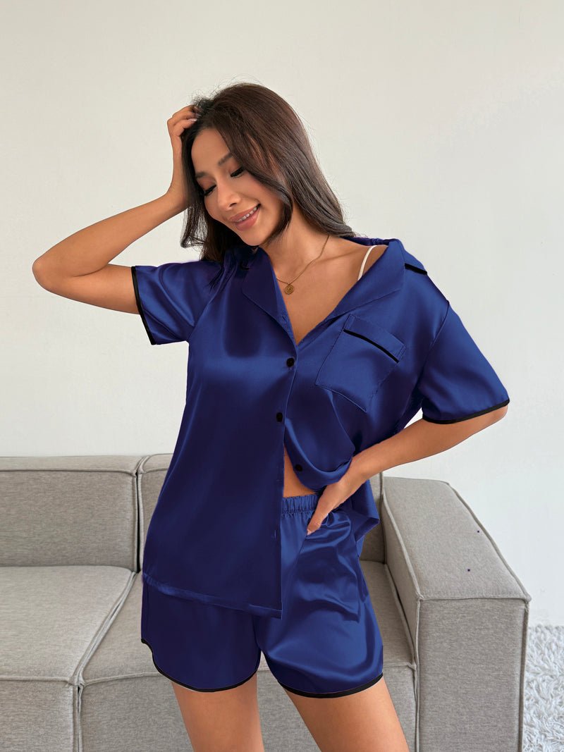 Satin pajama set in navy: short-sleeve button-down top with matching sleep shorts