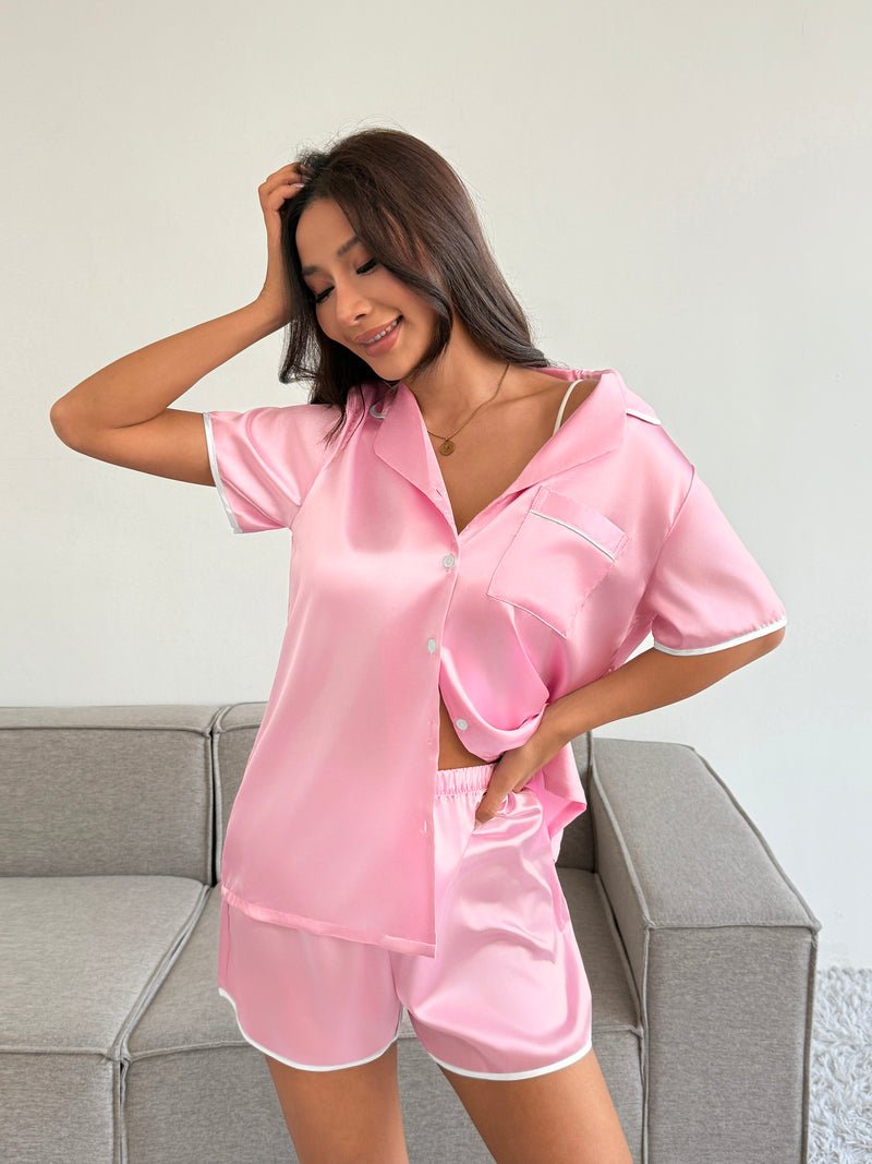 Satin pajama set in pink: short-sleeve button-down shirt with matching sleep shorts