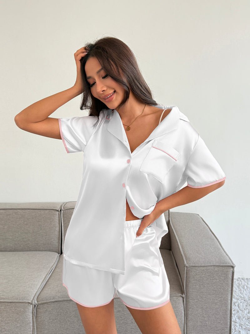 Satin pajama set in white: short-sleeve button-front top and matching sleep shorts