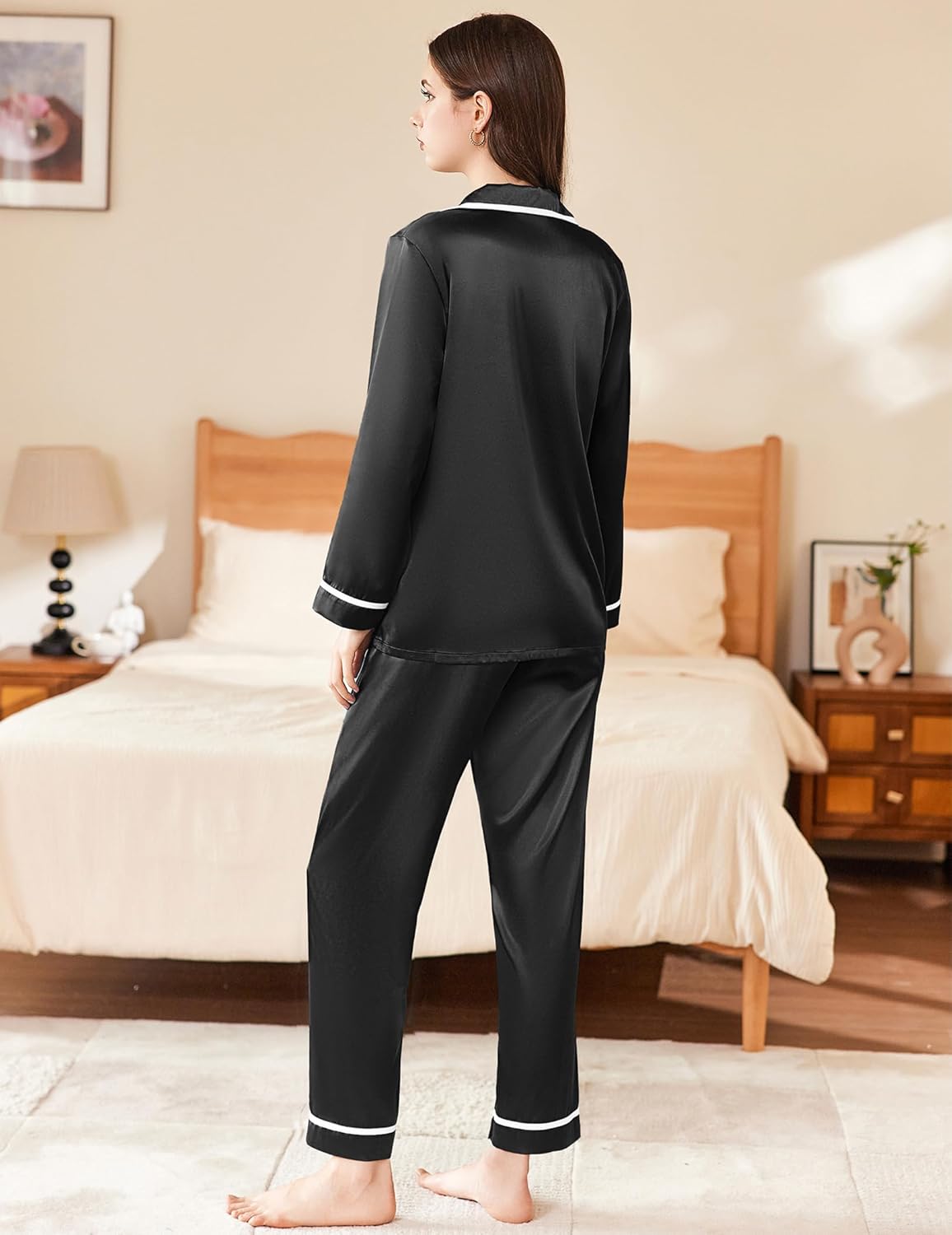Black satin pajama set, button-up top and straight-leg pants with contrast piping