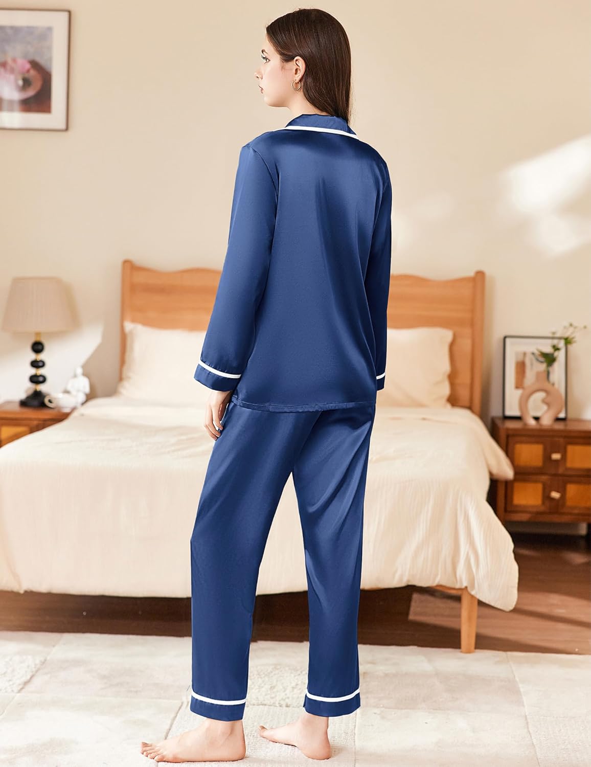 Navy blue satin pajama set, button-up top and straight-leg pants with contrast piping