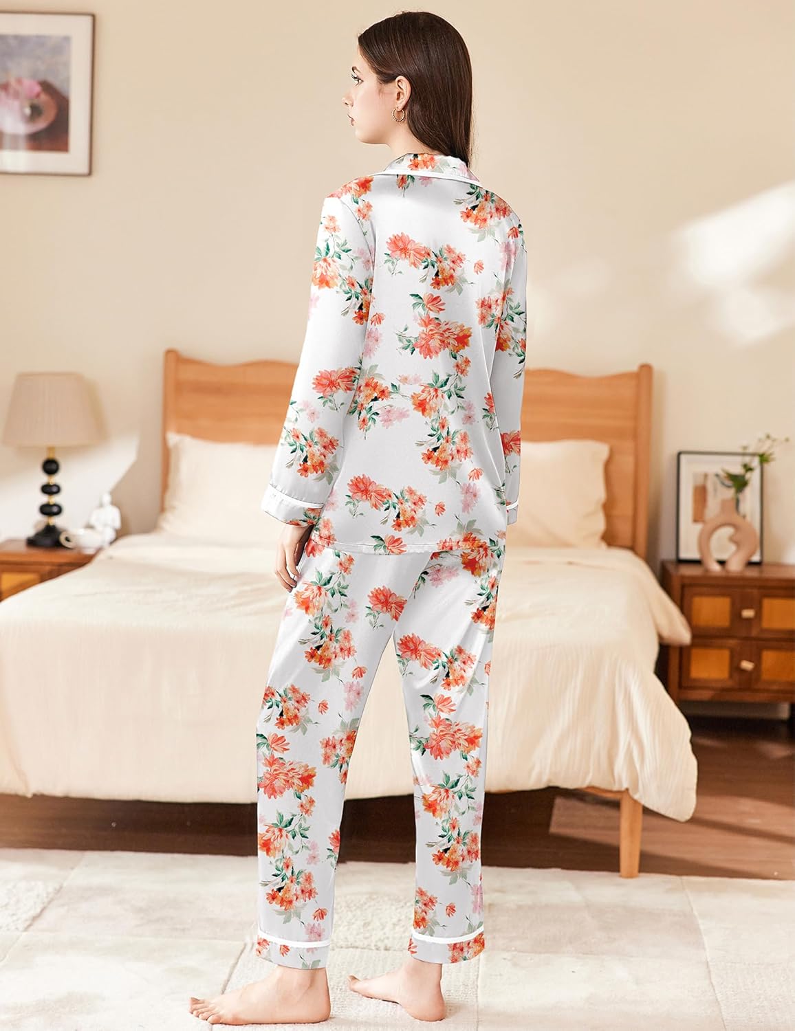 White floral satin pajama set, button-up top and straight-leg pants with contrast trim
