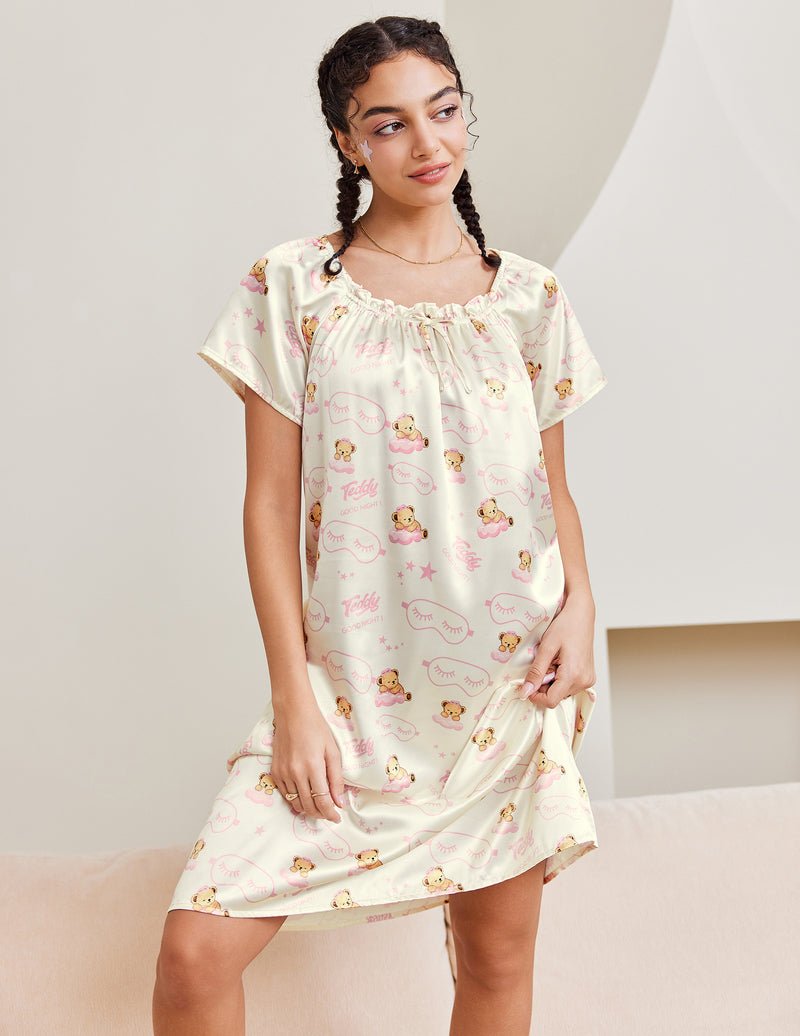 White satin nightgown with teddy print, pleated scoop neckline and short sleeves