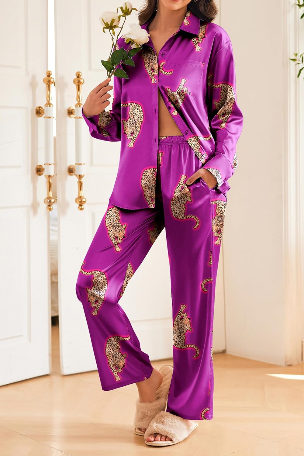Purple satin pajama set with gold animal print, button-front top and long pants.