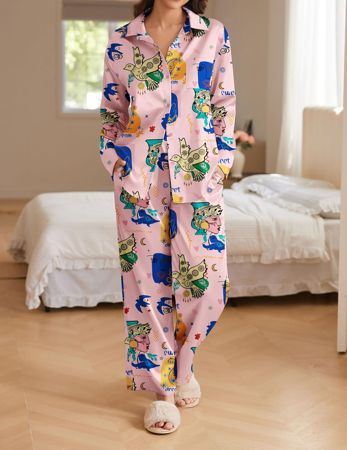 Pink playful animal print pajama set with button front top and full-length pants