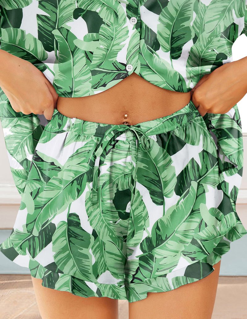 Green tropical leaf satin pajama set with knotted waistband and layered shorts