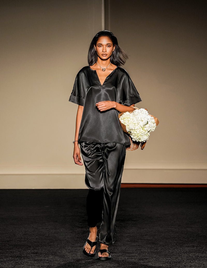 Black satin V-neck pajama set with short sleeves and drawstring wide-leg pants