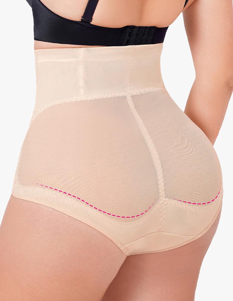 Seamless shaping shorts in beige with high-rise waistband and smooth front panels.