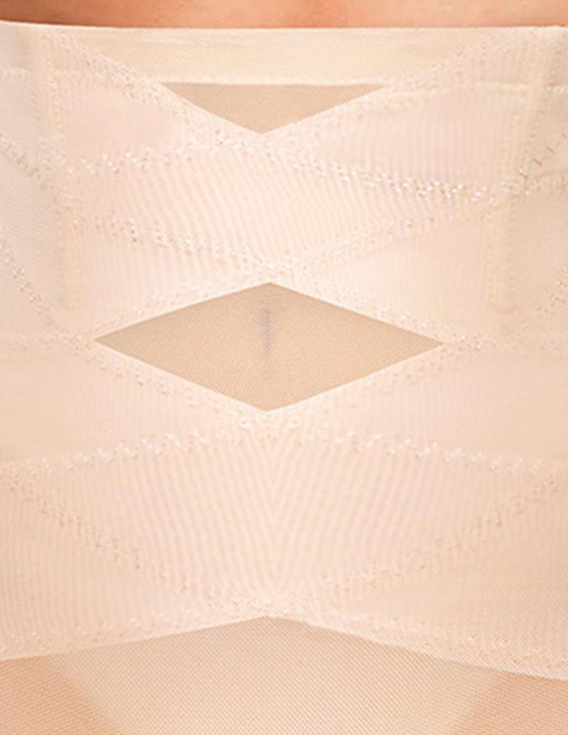 Seamless shaping shorts in beige close-up with diamond-patterned mesh paneling.
