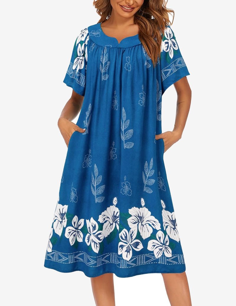 Floral short-sleeve house dress in bright blue with white leaf pattern and floral hem