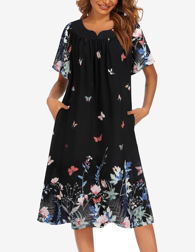 Floral short-sleeve house dress in black with colorful butterfly print across skirt