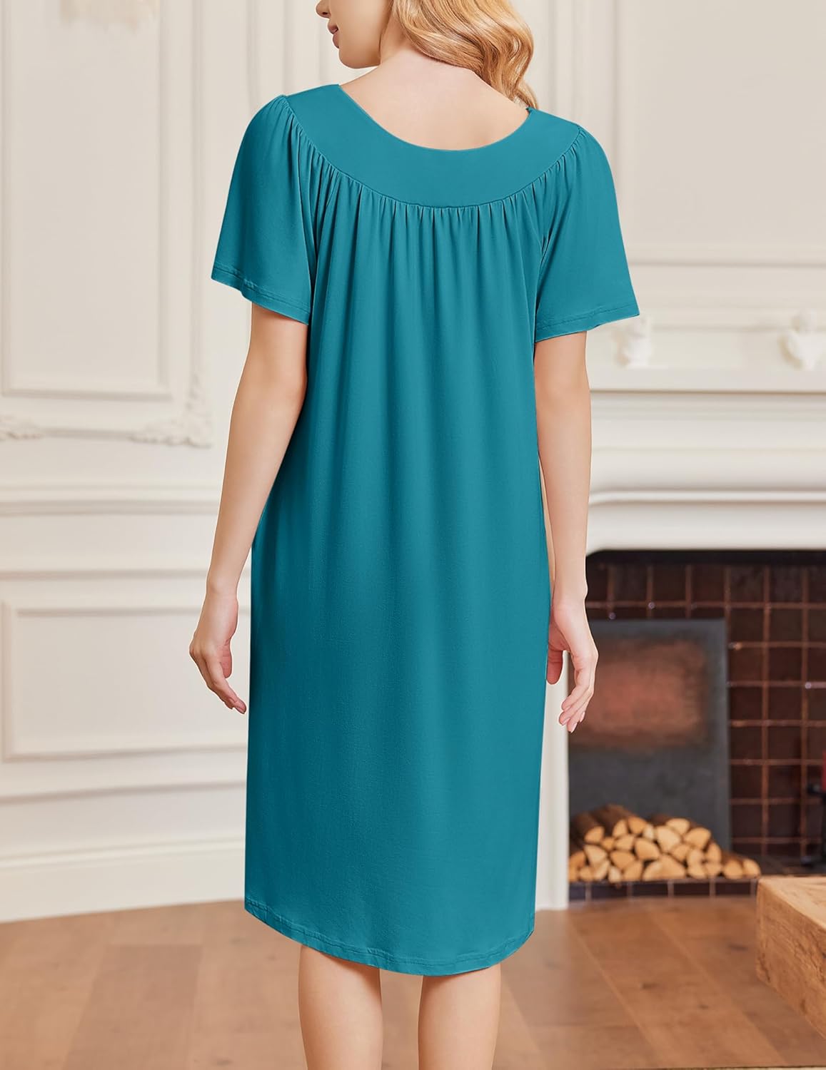 Teal short-sleeve house dress from back view, gathered yoke and straight midi length
