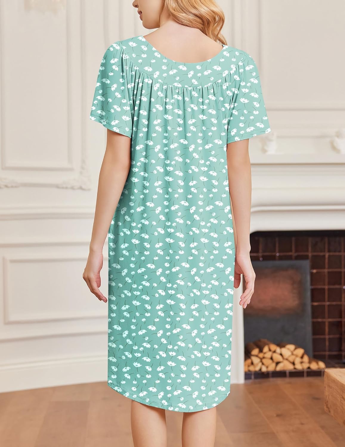 Teal floral short-sleeve house dress with gathered back yoke and knee-length hem