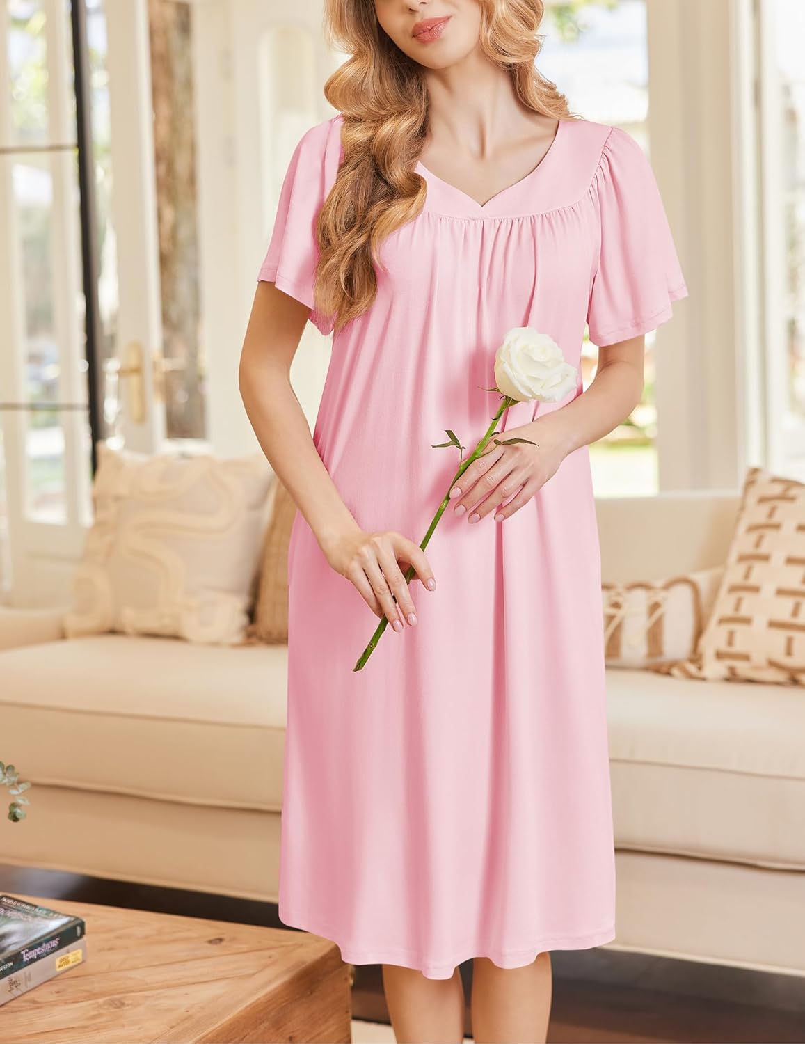 Light pink short-sleeve house dress with softly gathered neckline and knee-length hem