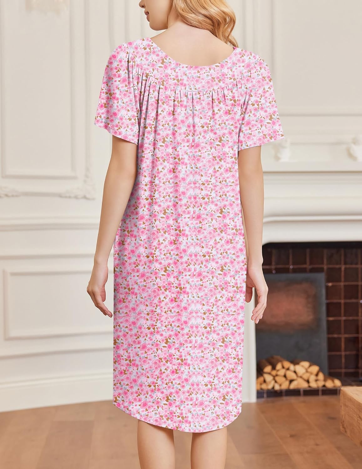Back view of pink floral short-sleeve house dress, gathered yoke detail
