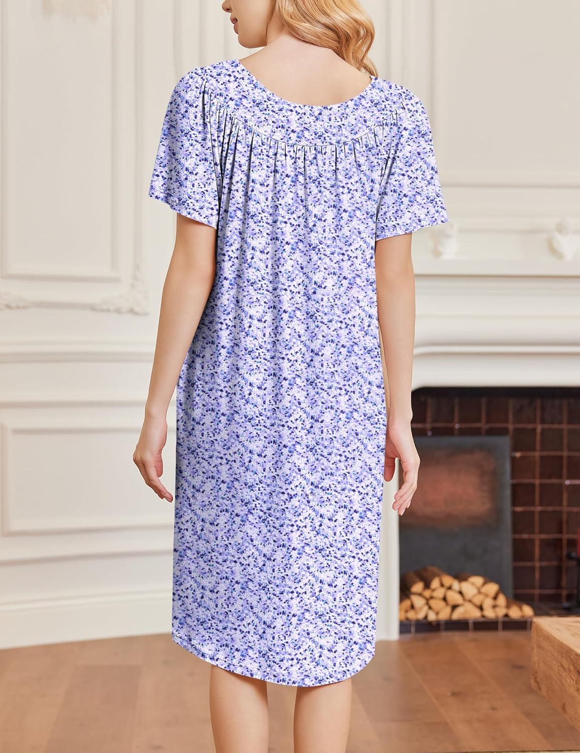 Back view of blue-and-purple floral short-sleeve house dress, relaxed fit