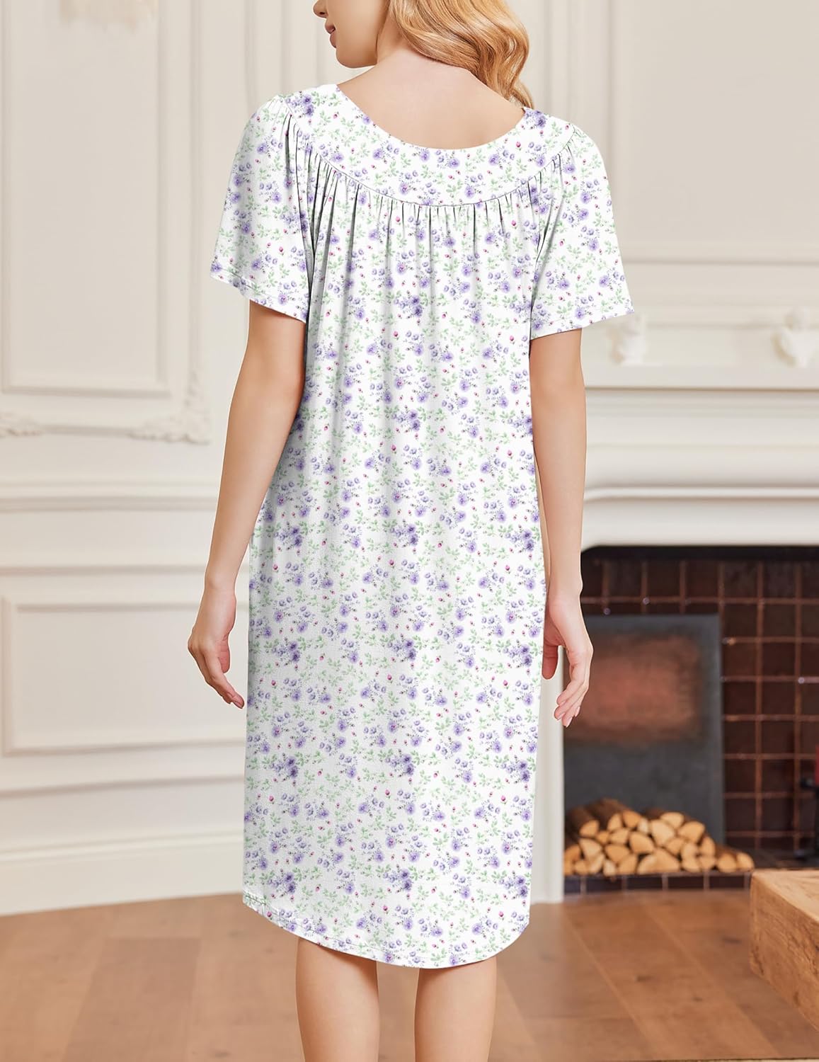 White short-sleeve house dress with purple floral print and gathered neckline detail