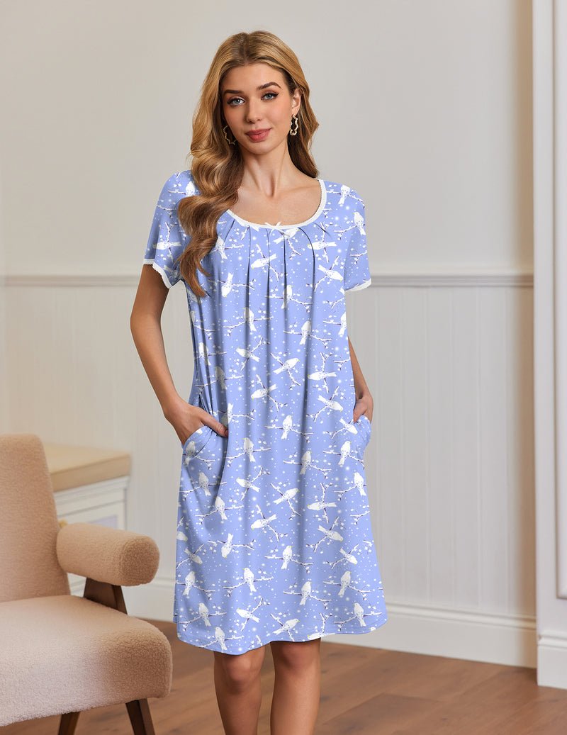 Blue short-sleeve house dress with gathered neckline and side pockets, white print