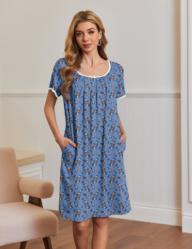Blue short-sleeve house dress with side pockets and gathered neckline, small red floral print