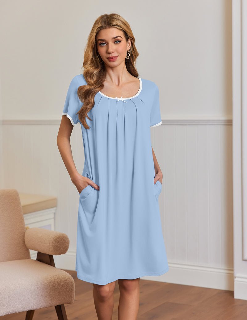 Light blue short-sleeve house dress with gathered neckline and side pockets