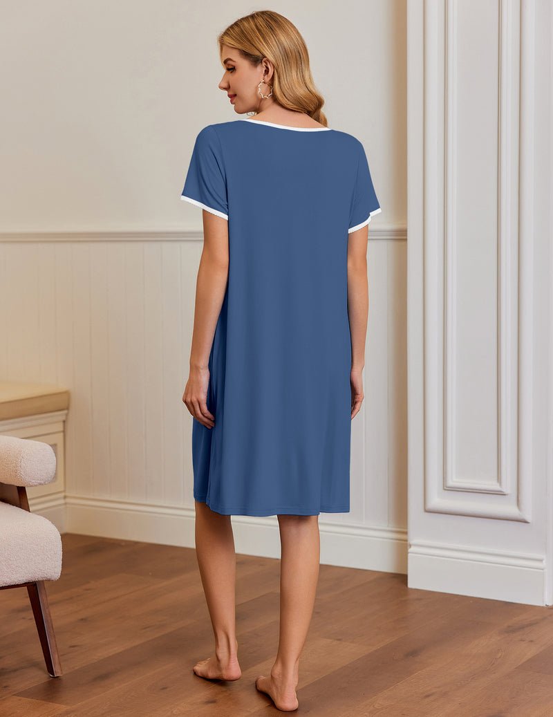 Blue short-sleeve house dress, back view; side pockets and pleated neckline trim