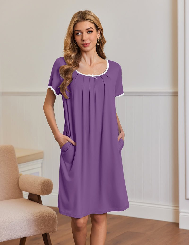 Purple short-sleeve house dress with side pockets, pleated yoke and white-trim neckline