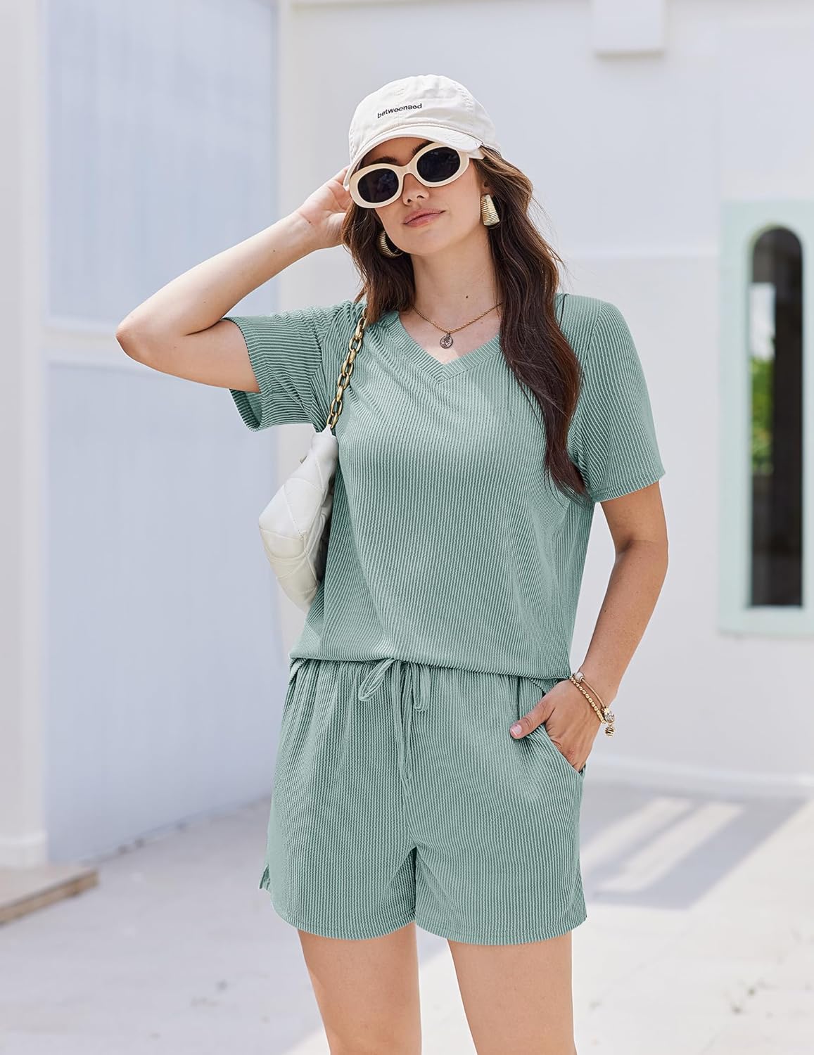 Green knit lounge set: short-sleeve V-neck top and drawstring waist shorts