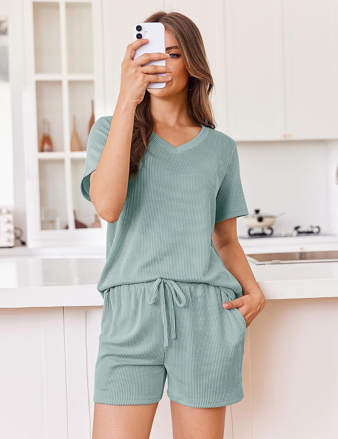 Teal knit lounge set with short-sleeve V-neck top and matching drawstring shorts