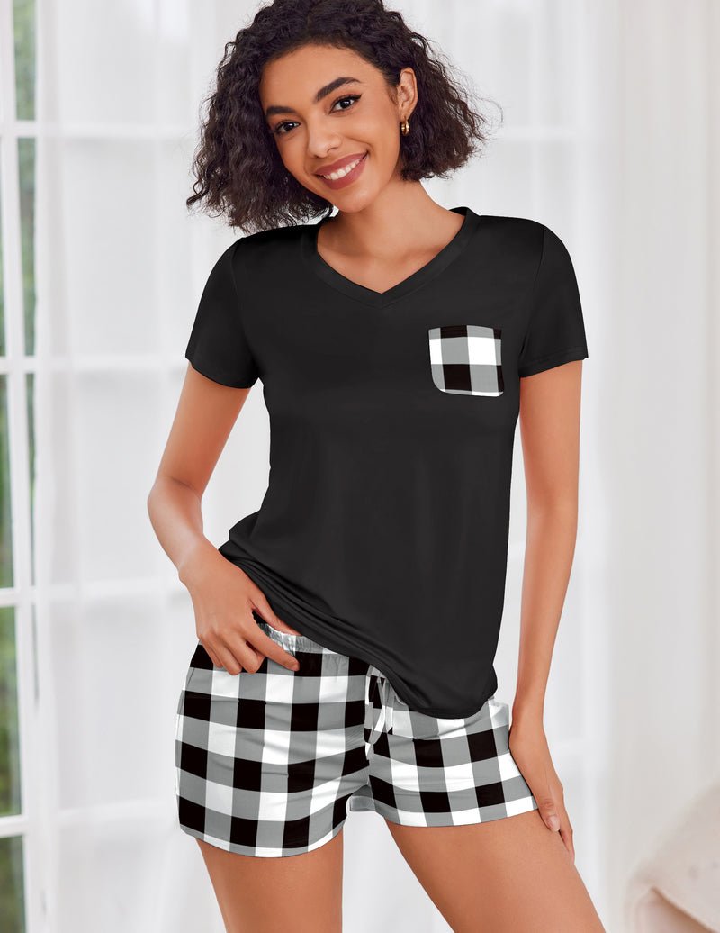 Black short-sleeve pajama set with V-neck top and black-and-white plaid drawstring shorts