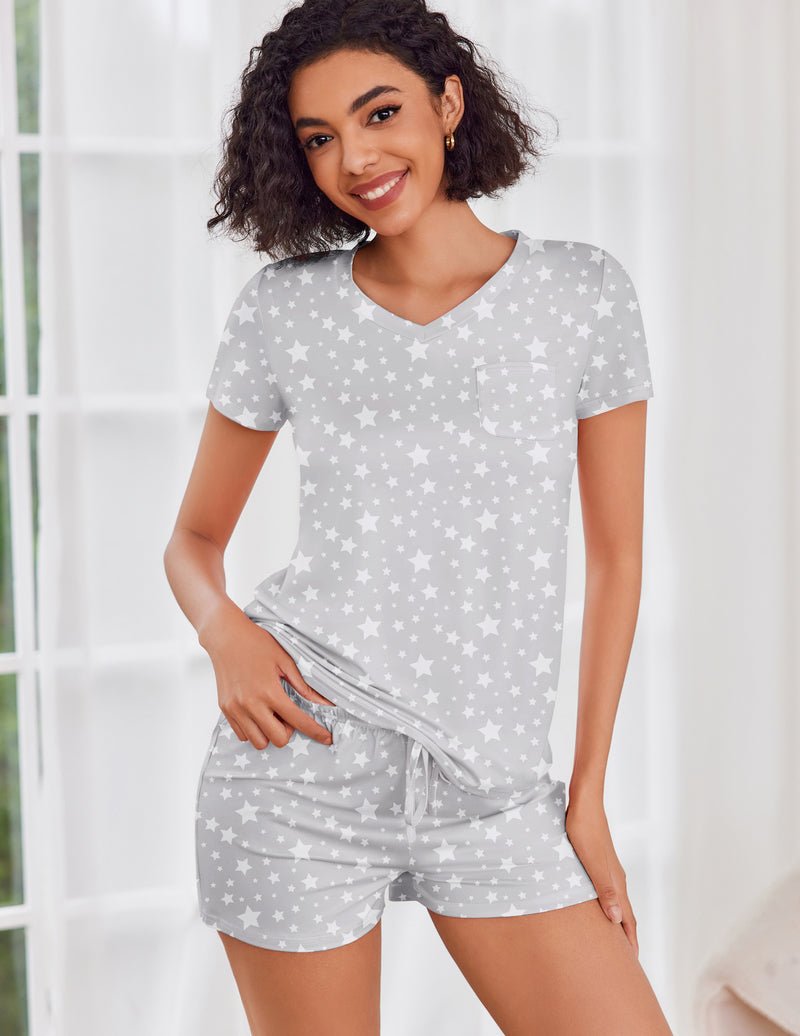 Light gray short-sleeve pajama set with star print top and matching drawstring shorts