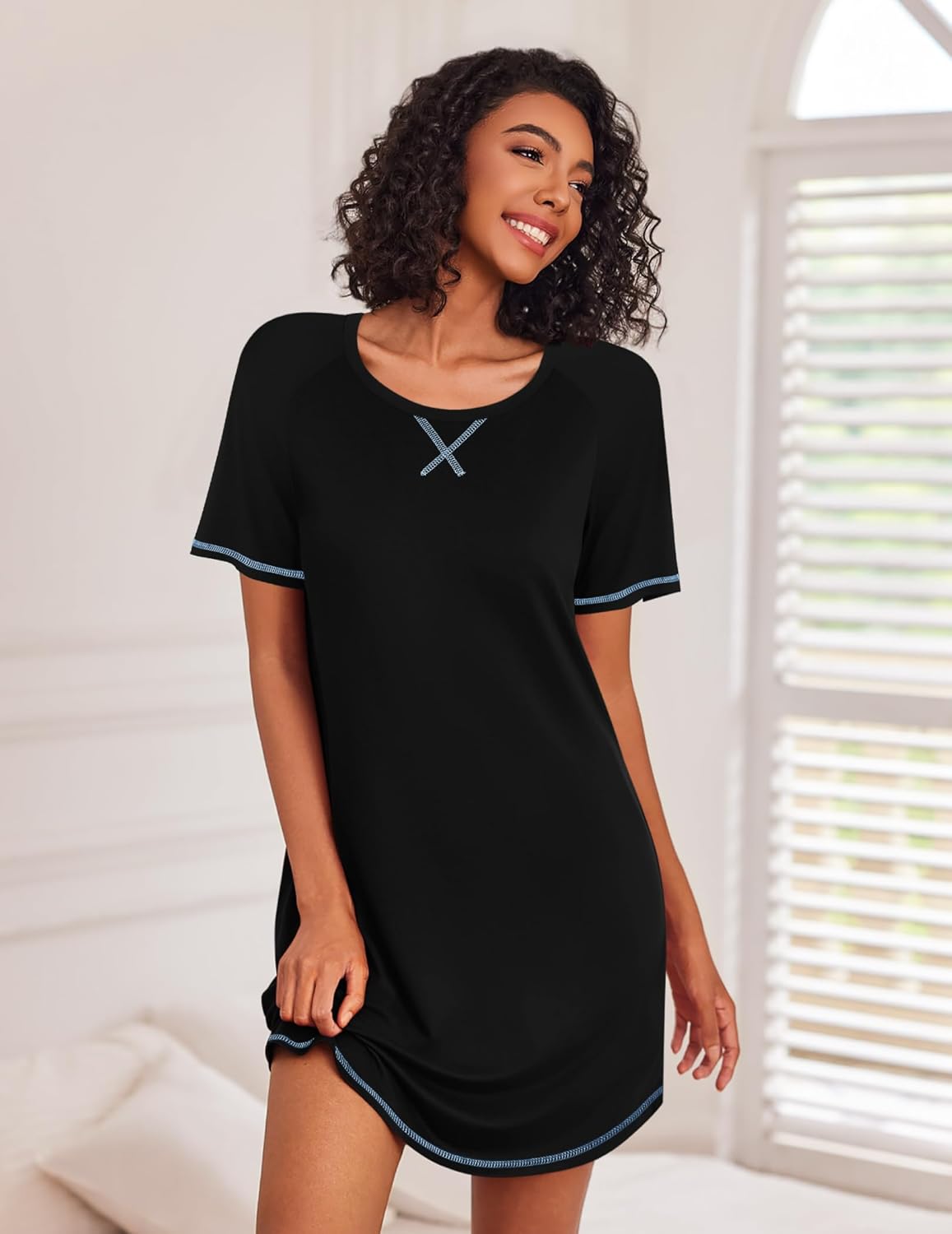 Black short-sleeve sleep shirt with light-blue piping at collar and hem