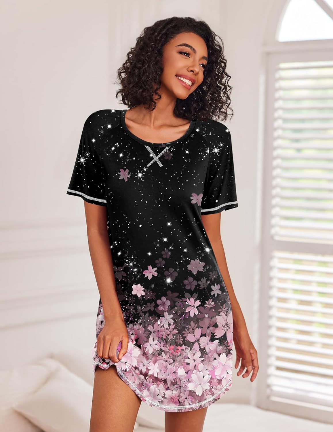 Black short-sleeve night shirt with starry print and pink floral hem