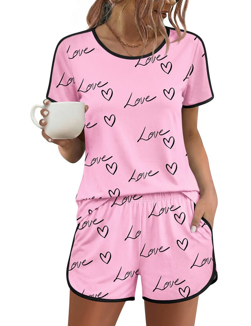 Pink pajama set with “Love” heart pattern, short sleeves and matching shorts