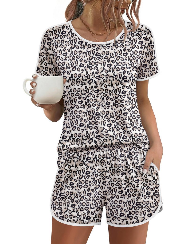 White leopard-print short-sleeve pajama set with crew neck and matching drawstring shorts